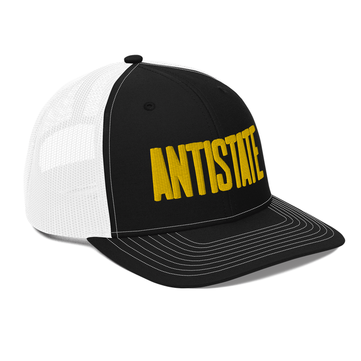 Stone black/gold trucker hat